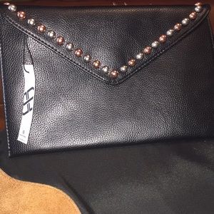 Too cute clutch with grommets
